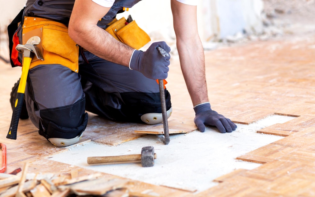 Professional redoing damaged flooring