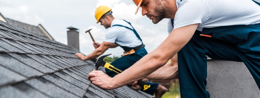 The Complete Guide to Roofing: Everything Homeowners Need to Know 1 Two workers installing new roof