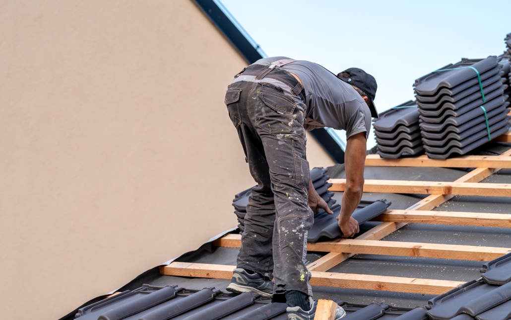 Worker installing new roof