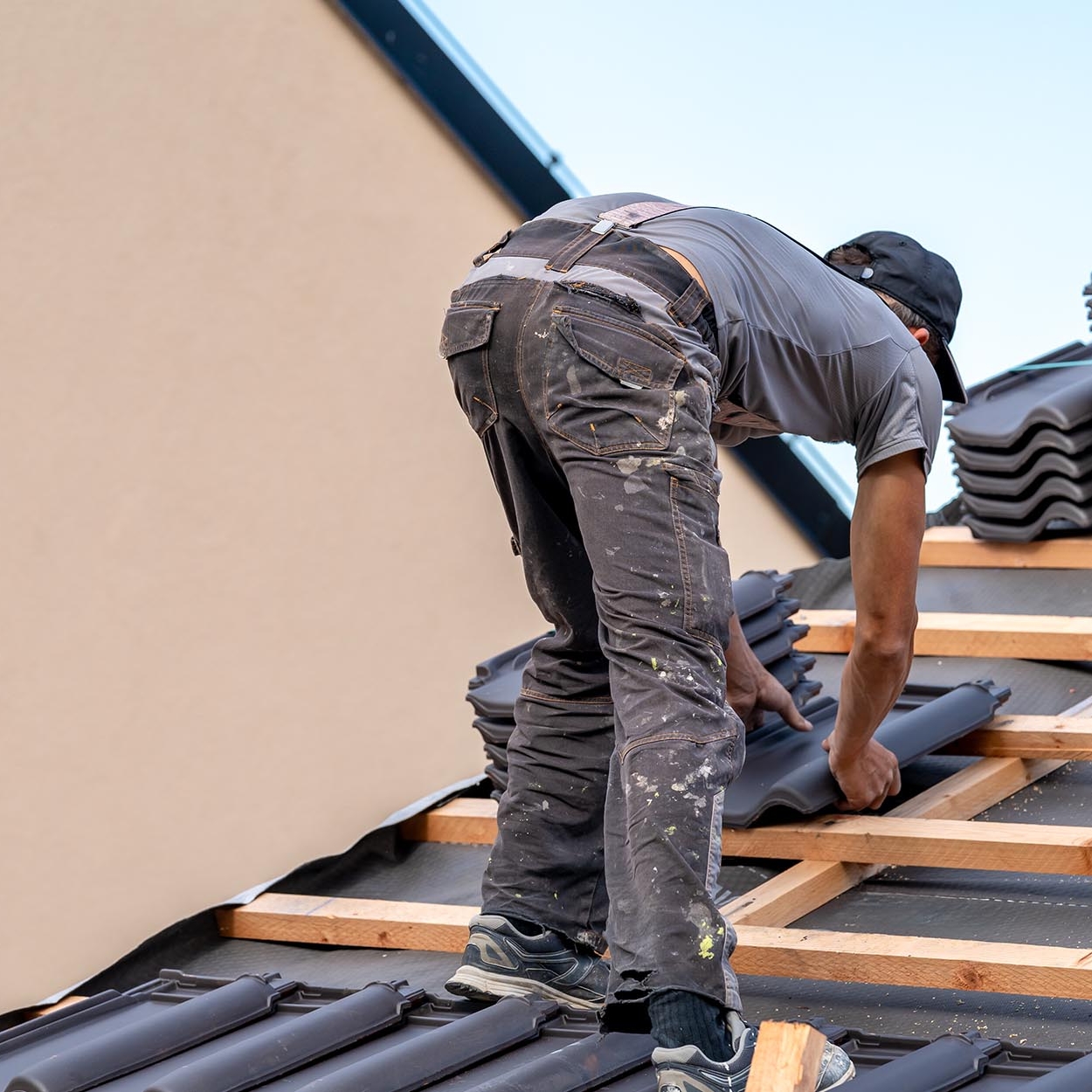 Worker installing new roof