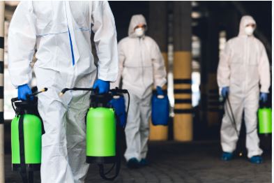 Professional commercial mold remediation team in protective gear removing mold from San Antonio business facility