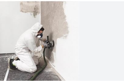 Professional commercial mold remediation team in protective gear removing mold from San Antonio business facility