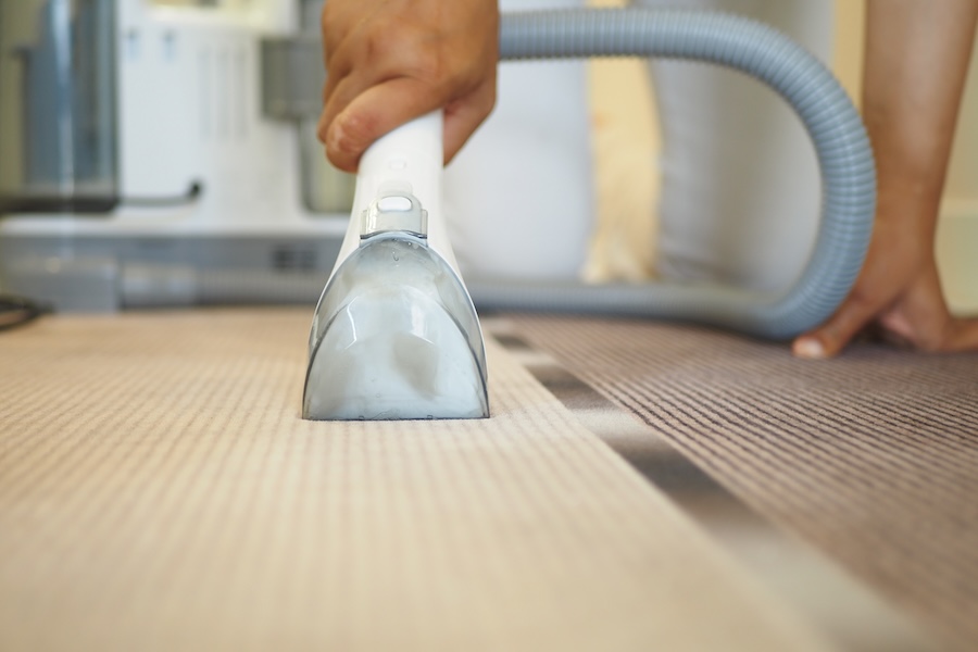 a closeup view of vacuuming a carpet in a contempo 2024 12 13 14 23 46 utc