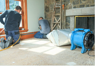 Professional Water Damage Restoration In Canyon Lake, Texas: Complete Recovery Solutions 5 restoration team using advanced equipment for water damage restoration in Canyon Lake TX
