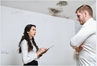 San Antonio homeowner documenting water damage for insurance claim with Prime Time guidance