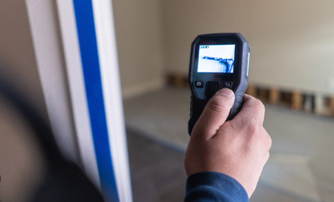 Top Water Damage Restoration Companies in San Antonio: Your Ultimate Guide to Professional Recovery 4 Water damage restoration companies San Antonio technician using moisture meter to assess structural drying progress