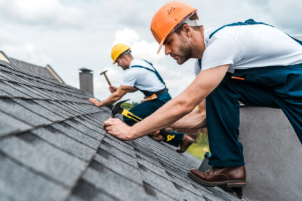 Commercial Roofing Water Damage Restoration Solutions 9 Prime Time commercial roofing restoration team working on large hotel roof water damage in San Antonio