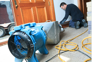 Prime Time water damage restoration team working in Buda TX with professional equipment
