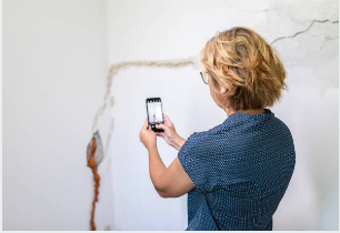 Professional Water Damage Restoration In Canyon Lake, Texas: Complete Recovery Solutions 6 Canyon Lake TX homeowner safely documenting water damage before professional restoration
