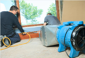 Prime Time water damage restoration Fair Oaks Ranch team using commercial drying equipment in custom home restoration