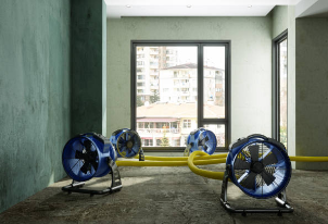 Professional water damage restoration Selma TX home - equipment showing industrial fans and dehumidifiers