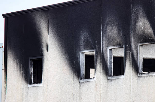 Commercial property fire damage restoration in Live Oak showing structural damage to modern building