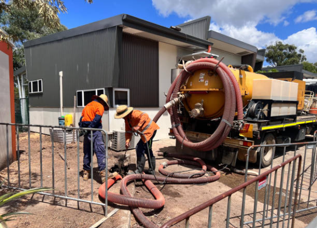 Emergency fire damage restoration in Live Oak showing immediate water extraction and structural drying response