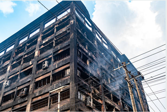 Commercial property fire damage restoration in Live Oak showing structural damage to modern building