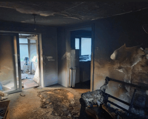 Fire damage restoration in Spring Branch property showing smoke damage and structural assessment