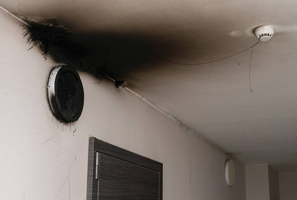 Fire damage restoration in San Marcos soot and smoke damage on walls requiring professional cleaning
