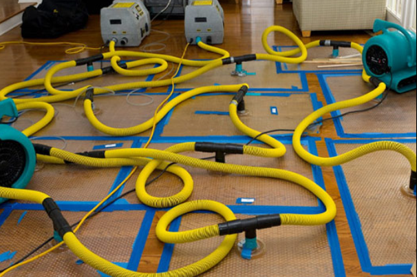 Professional fire damage restoration in San Antonio water extraction equipment removing firefighting water damage
