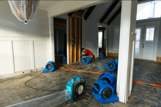 Water Mitigation Services Explained: What They Are and Why You Need Them Immediately 5 water mitigation services crew setting up drying equipment inside a San Antonio home